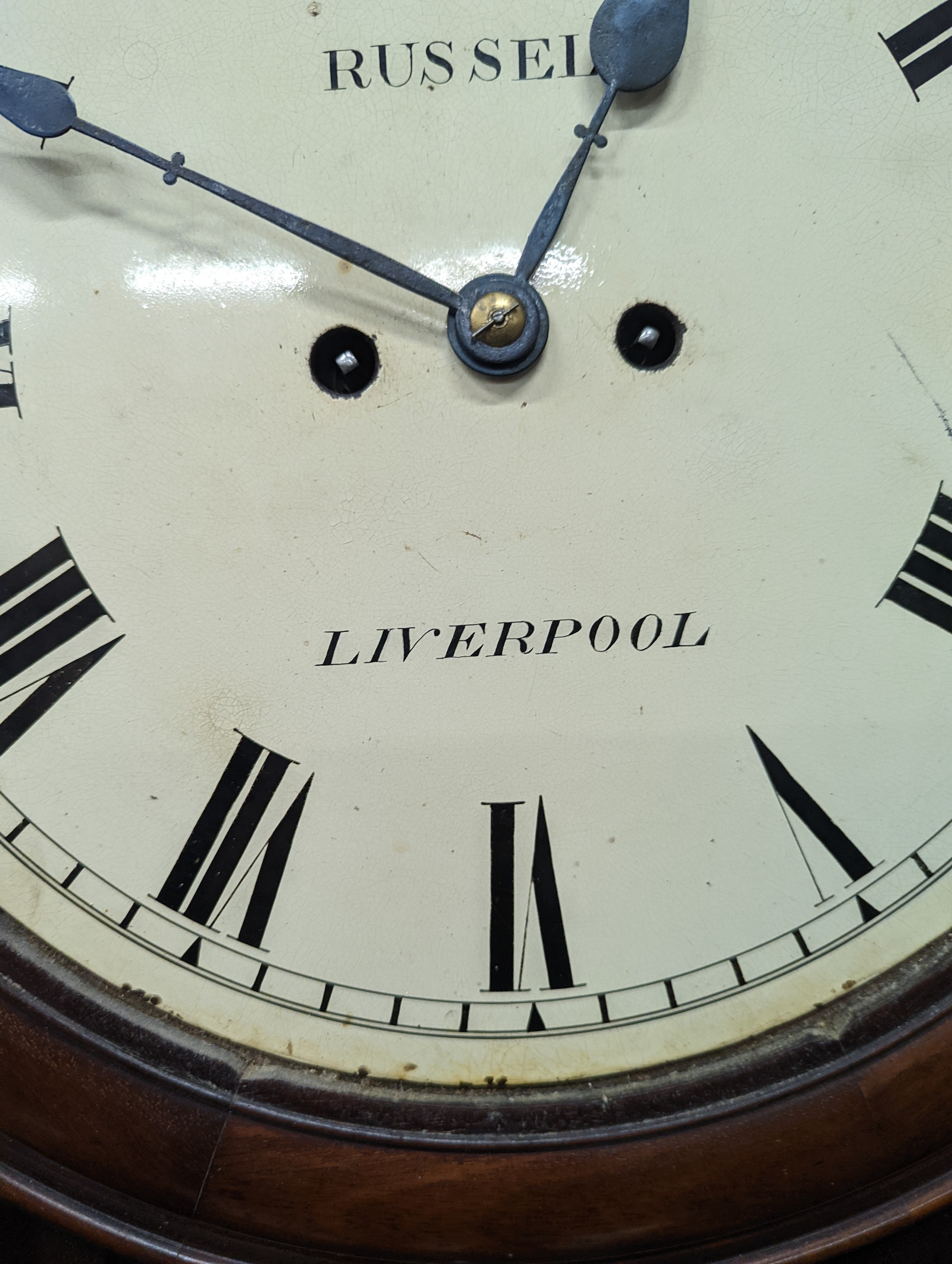 A Victorian mahogany drop dial wall clock, with twin fusee movement, and circular white painted Roman dial signed 